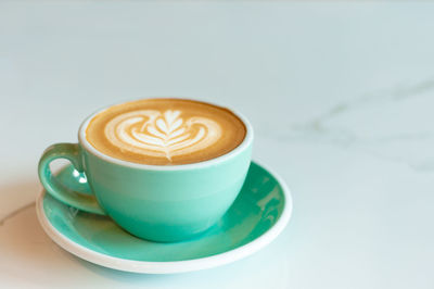 Close-up of cappuccino on table