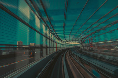 Blurred motion of train at railroad tracks