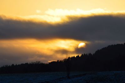 Scenic view of silhouette landscape against sky during sunset