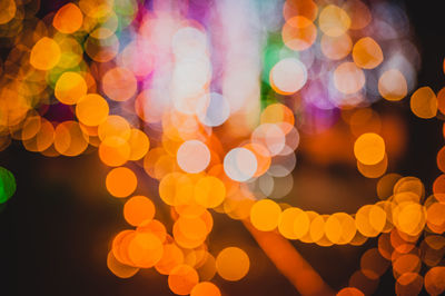 Defocused image of illuminated christmas lights