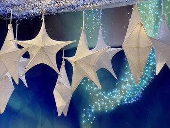 Close-up of christmas decorations hanging on glass