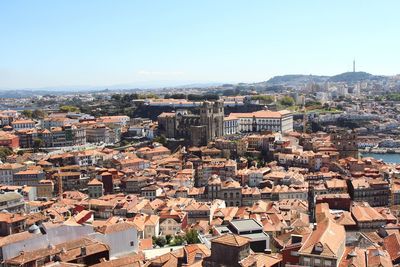 Aerial view of cityscape against clear sky