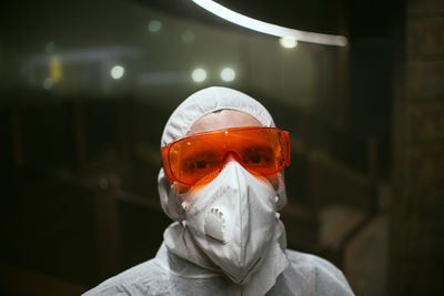 Portrait of man wearing protective goggles in laboratory