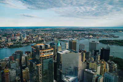 High angle view of cityscape against cloudy sky