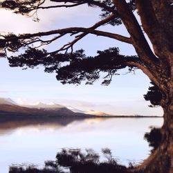 Scenic view of lake with mountains in background