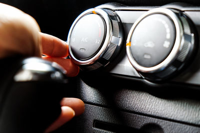 Close-up of hand holding car