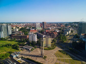 High angle view of buildings against clear sky