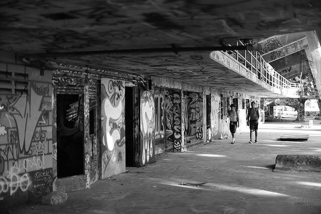 PEOPLE ON CORRIDOR IN BUILDING