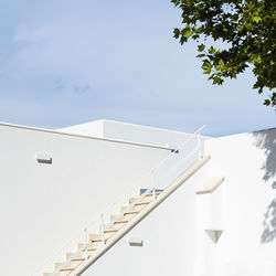 Low angle view of white building against sky