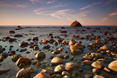 Scenic view of baltic sea against sky during sunset