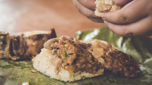 Close-up of man holding ice cream in plate