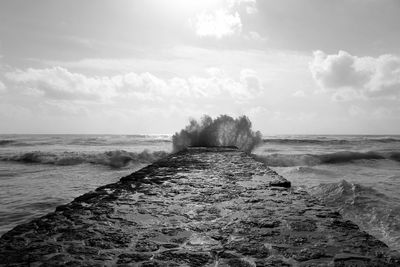 Sea wave splashing on groyne