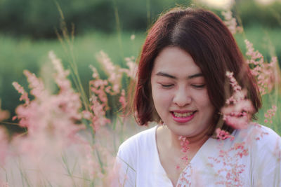 Portrait of a smiling young woman outdoors