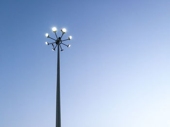 Low angle view of street light against clear blue sky