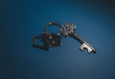 High angle view of electric lamp against blue background