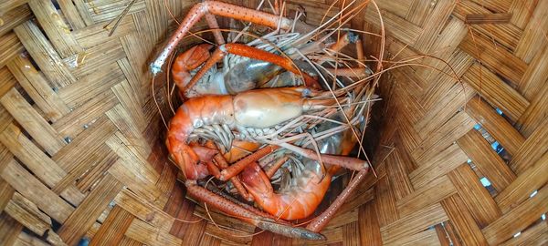 High angle view of eggs in basket on table