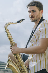 Low angle view of man playing guitar