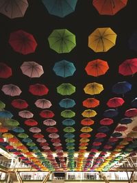 Low angle view of illuminated lanterns hanging in city