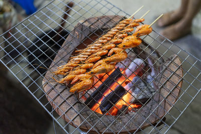 Close-up of meat on barbecue grill