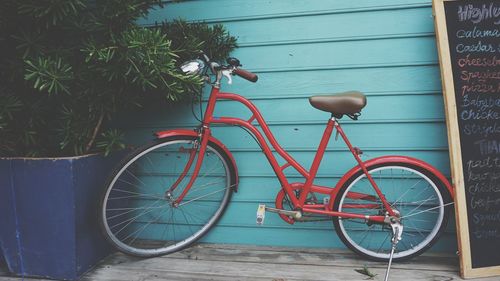 Bicycle against blue wall