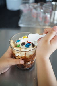 Close-up of hand holding ice cream