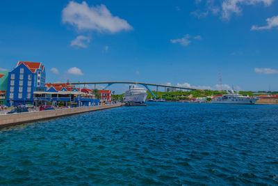 View of bridge over sea against cloudy sky