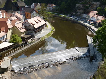 High angle view of river amidst buildings in town