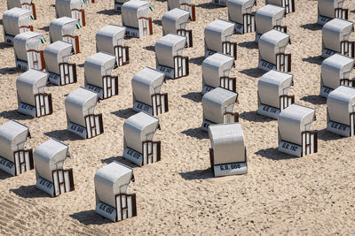 High angle view of chairs on beach