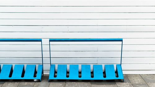 Bicycle racks against white wall