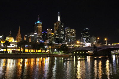 Illuminated city lit up at night