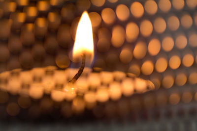 Close-up of illuminated candle