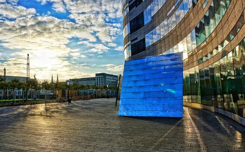 Modern office building against sky in city