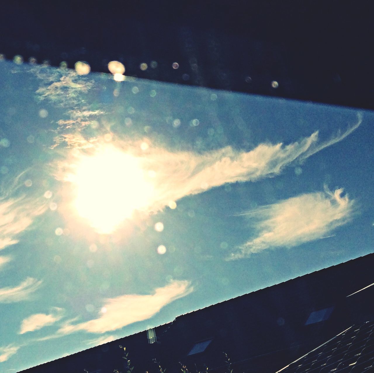 sky, cloud - sky, built structure, low angle view, architecture, building exterior, sunlight, reflection, sun, cloud, glass - material, nature, outdoors, no people, silhouette, part of, city, cloudy, day, window