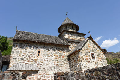 Low angle view of building against blue sky