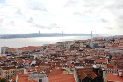 View of town against cloudy sky