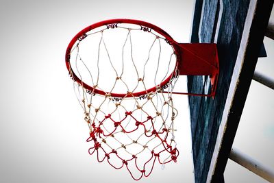 Low angle view of basketball hoop against clear sky