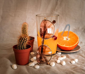 Close-up of wineglass on table against wall