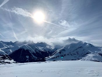 Scenic view of snowcapped mountains against sky