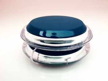 High angle view of glasses on table against white background