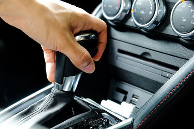 Close-up of hand holding car