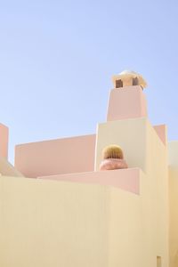 Low angle view of woman against sky