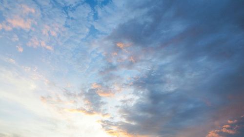 Low angle view of clouds in sky during sunset