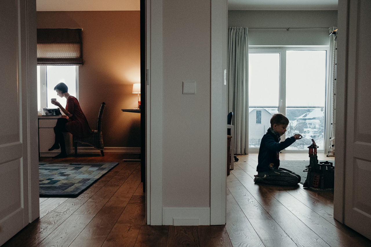 PEOPLE SITTING IN CORRIDOR OF HOME