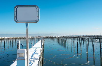 The marina at the ostseebad grömitz on the baltic sea frozen over in winter