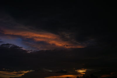 Low angle view of dramatic sky at sunset