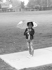 Portrait of smiling boy standing outdoors