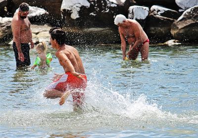 Blurred motion of man running in water