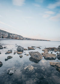 Scenic view of sea against sky during winter