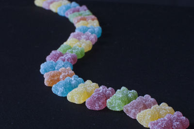 High angle view of multi colored candies on table