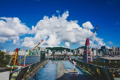 Panoramic view of bridge over city against sky